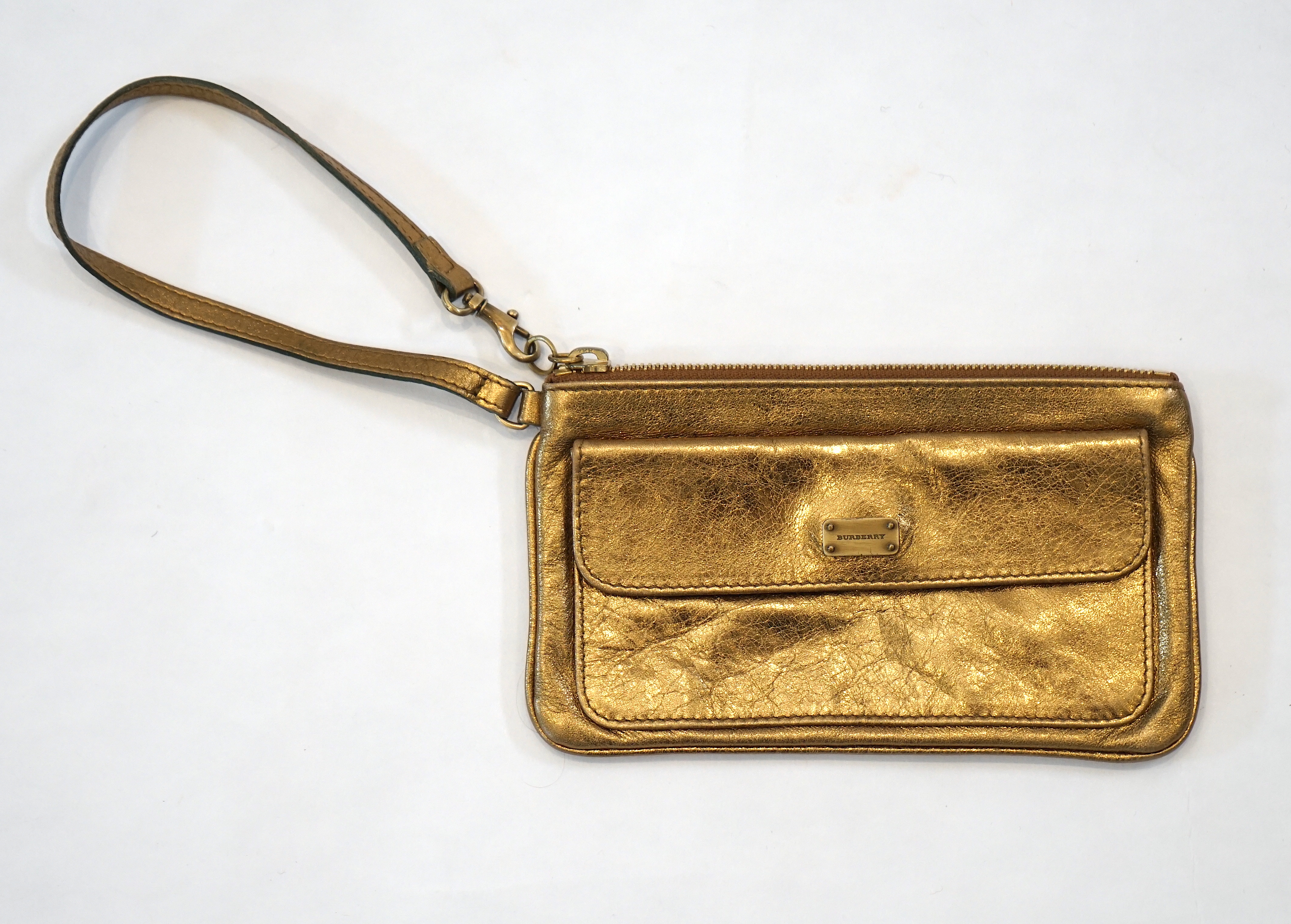 A Burberry gold leather clutch bag with original dust bag, approx length 19.5cm, height 11cm